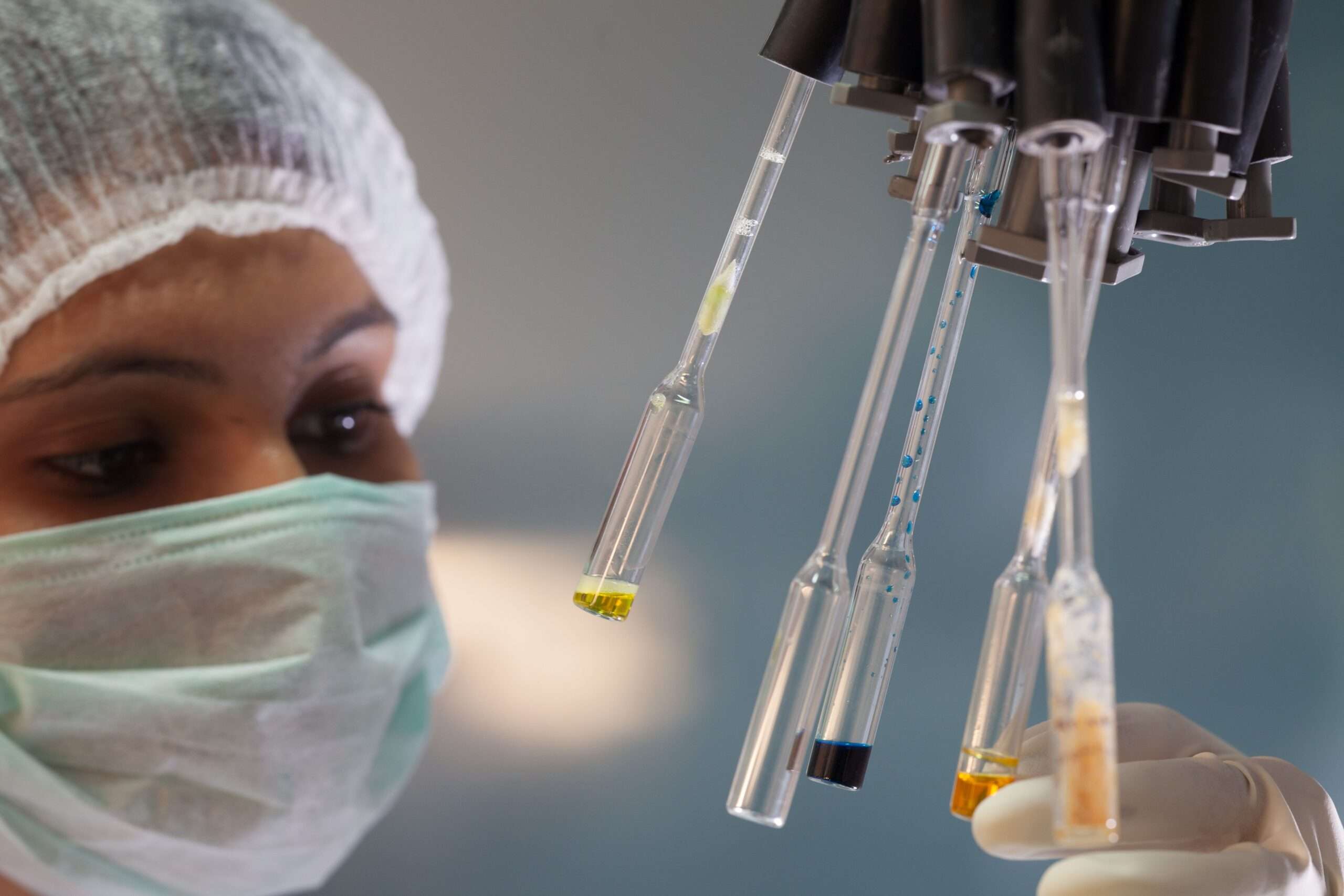 Laboratory technician analyzing an air sample for particulate testing